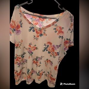 White floral soft shirt with purple and orange flower designs.